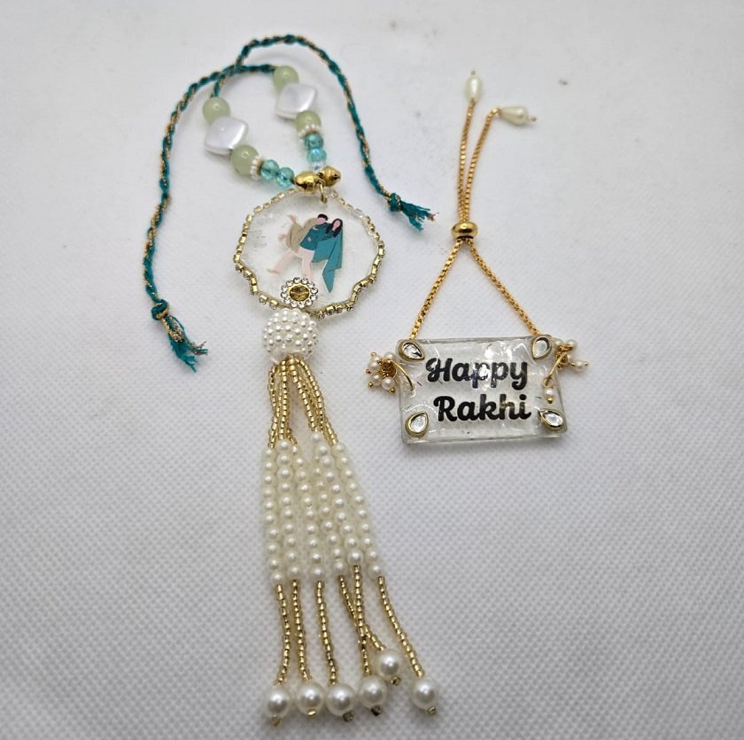 Designer Couple Theme Pearl Tassel Rakhi with Happy Rakhi Bracelet Set